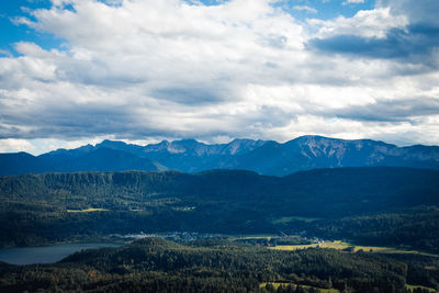 Scenic view of mountains against cloudy sky
