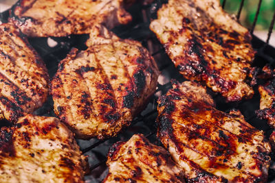 High angle view of meat on barbecue