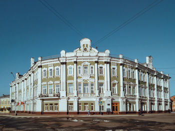 Low angle view of building against blue sky