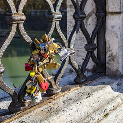 Close-up of padlocks on railing