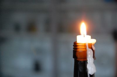 Close-up of lit candle