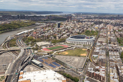 High angle view of yankee stadium amidst cityscape