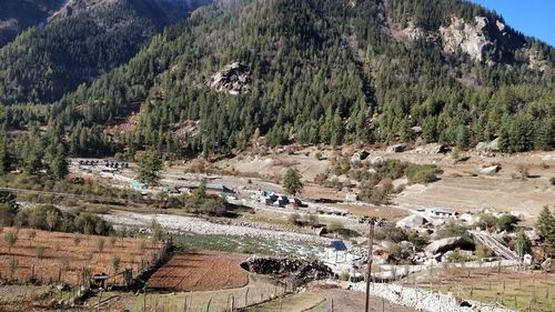 High angle view of road by trees and mountains