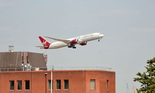 Low angle view of airplane flying in sky