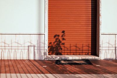 Doormat against closed metallic shutter