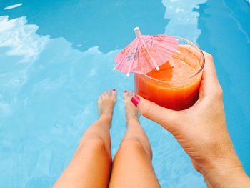 Low section of woman in swimming pool