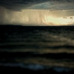 Scenic view of sea against dramatic sky