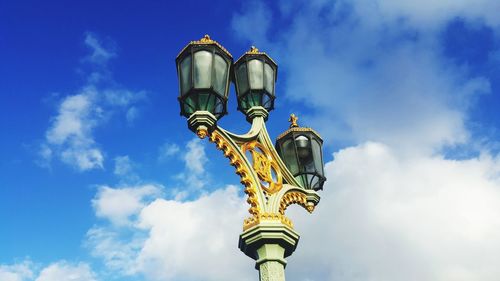 Low angle view of street light against sky