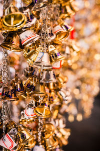 Close-up of bells hanging for sale