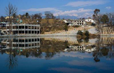 Reflection of building and trees in lake