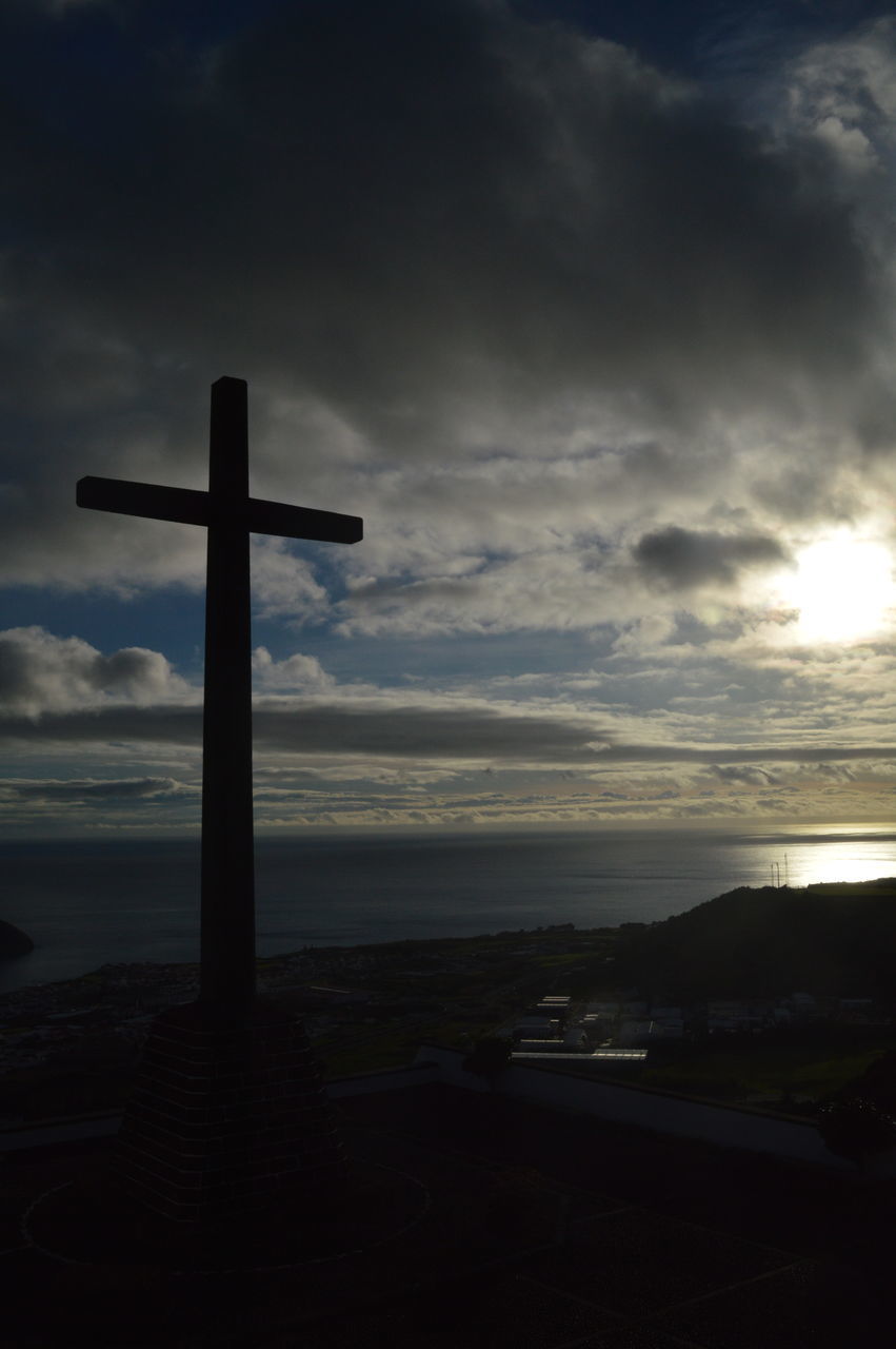 CROSS ON SEA AGAINST SKY