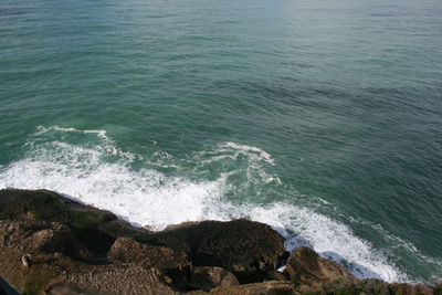 Waves splashing on rocks