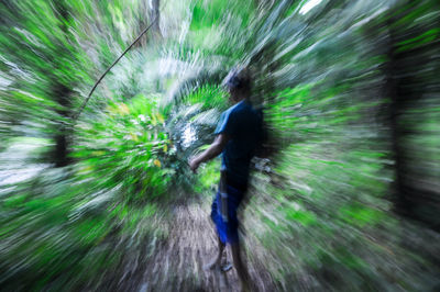 Blurred motion of man walking outdoors