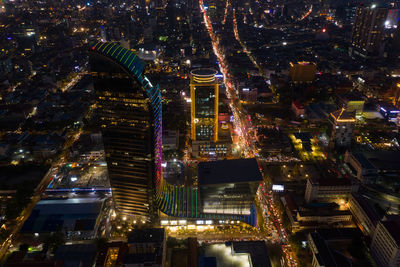 High angle view of illuminated buildings in city at night