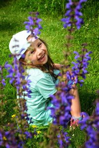 Portrait of smiling girl on purple flowering plants