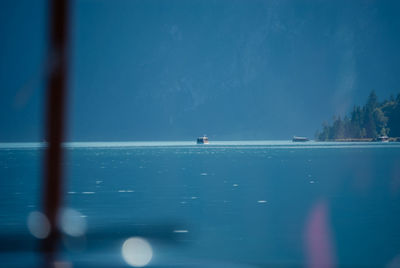 Scenic view of sea seen through glass