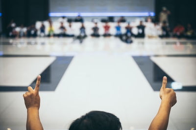 Man gesturing during event