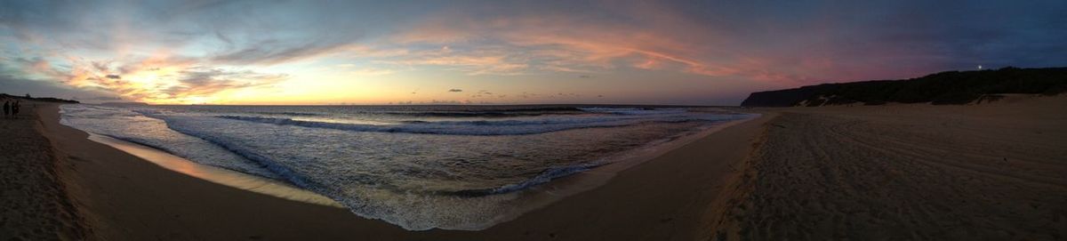 Scenic view of calm sea at sunset