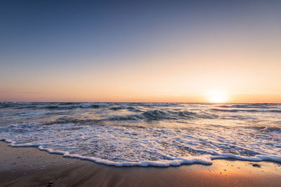 Scenic view of sea against sky during sunset