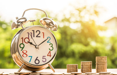 Close-up of clock on wood