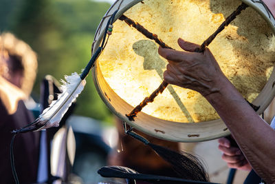 Close-up of hand holding drum