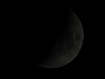 Low angle view of moon against sky at night