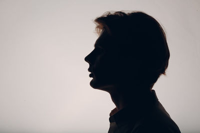 Portrait of woman against white background