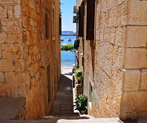 Narrow walkway leading to building