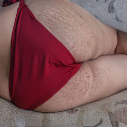 Midsection of woman lying down