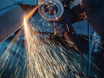 Low angle view of man working at factory