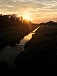 Scenic view of landscape against sky during sunset