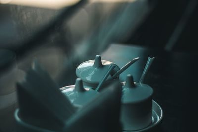 Close-up of cups on table