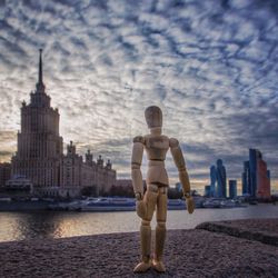 Full length of man standing on beach against sky