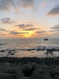 Scenic view of sea against sky during sunset