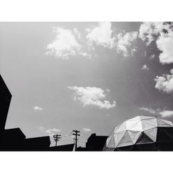 Low angle view of building against cloudy sky