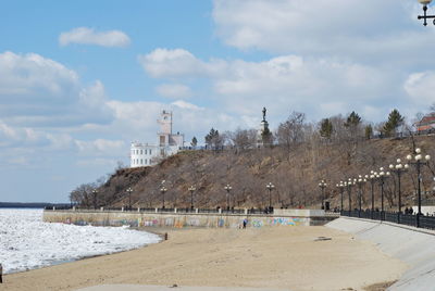 Panoramic shot of beach by sea against sky