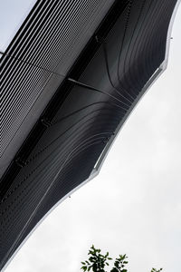 Low angle view of bridge against sky in city