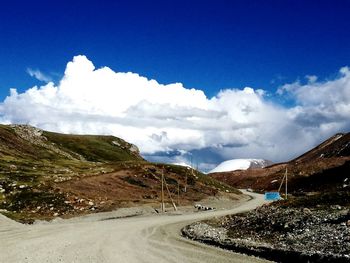 Scenic view of mountain road against sky