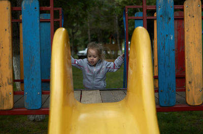 Full length of boy playing in playground