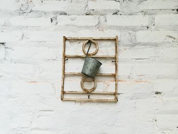 Close-up of white box on stone wall