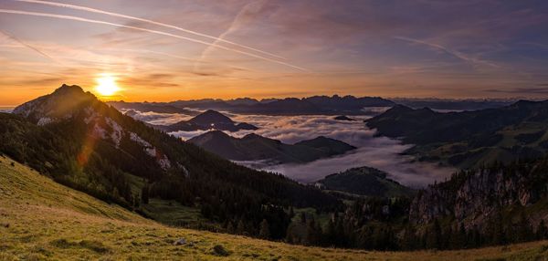 Scenic view of mountains against sky during sunset