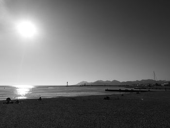 Scenic view of beach against clear sky