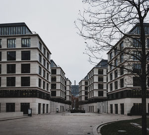 Street amidst buildings against sky