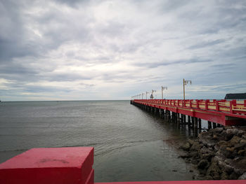 Pier over sea against sky