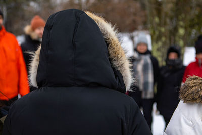 Rear view of people in winter