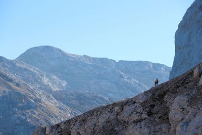 Scenic view of mountains against clear blue sky