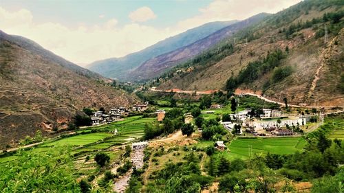 Scenic view of landscape and mountains against sky