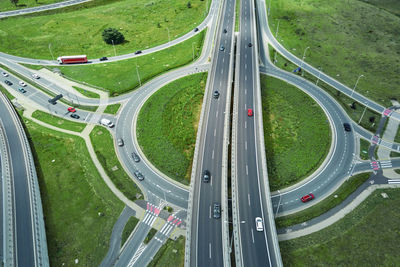 Roundabout intersection with driving cars. car traffic on highway with junction in wroclaw, poland