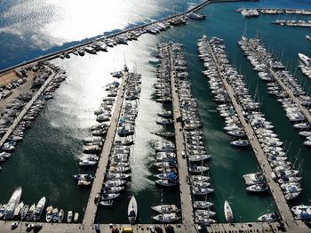 High angle view of sailboats moored in sea