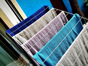 Low angle view of clothes drying against building